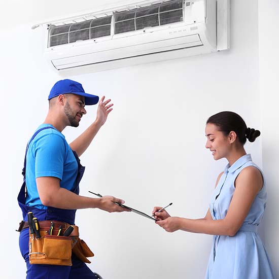 New Air Conditioning System is installed with happy homeowner signing paperwork